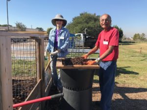Fort Bend Master Gardeners working in the composting area